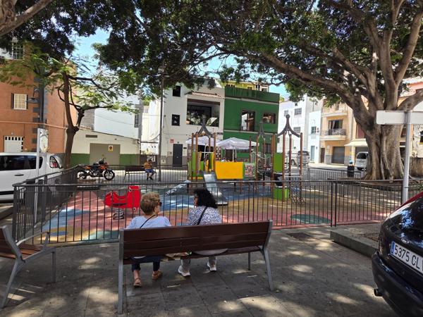 Playground and seating in plaza